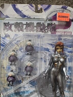 Silver Sci-Fi Female Action Figure with Purple Pods